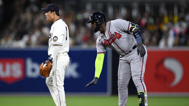 Apr 17, 2023; San Diego, California, USA; Atlanta Braves designated hitter Marcell Ozuna (20) gestures from second base after hitting a double during the fifth inning against the San Diego Padres at Petco Park. Mandatory Credit: Orlando Ramirez-USA TODAY Sports